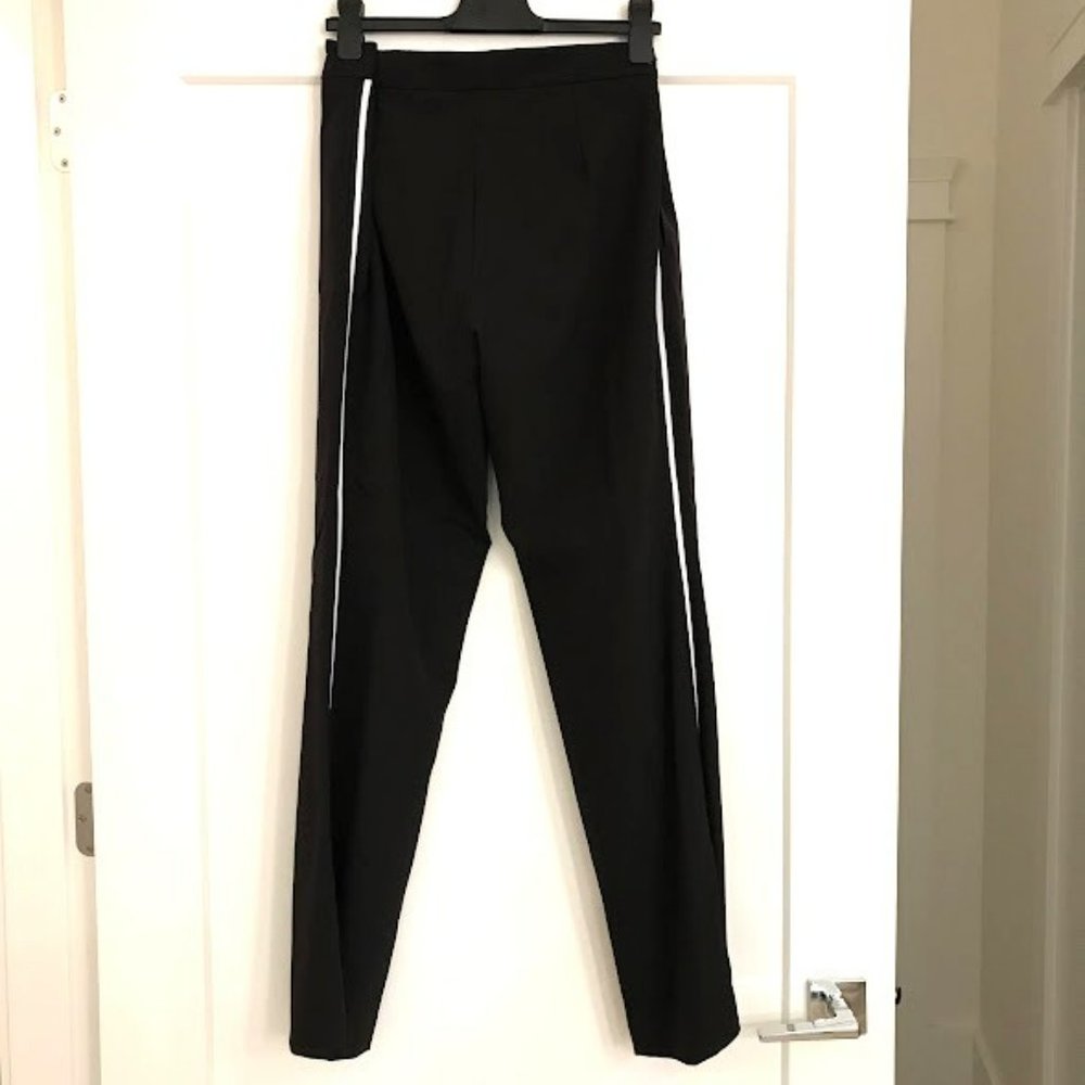 Black Sz 12 pants by Tracy Moore with white stripes down each size.